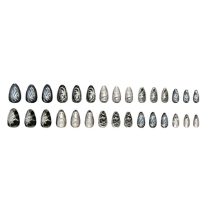 Dark punk stiletto press-on nails with silver flame and spider patterns on white background