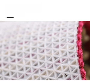 Macro detail of anti-slip TPR backing with triangular texture on durable door mat
