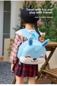 Detail of light blue cartoon bunny backpack with 3D ears for preschool kids outdoors
