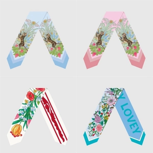 Various patterns of narrow twilly silk scarves featuring floral and tiger designs