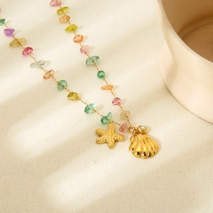 Ocean style beaded necklace with 18K gold starfish shell charms and colorful stones