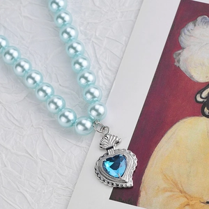 Blue pearl beaded necklace with radiant heart sapphire pendant in retro chic style