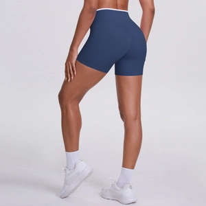 Rear view of high-waisted crossover yoga shorts in grey-blue with peach lift effect