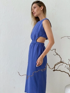 Detail view of royal blue crinkle fabric maxi dress with side waist cutout design