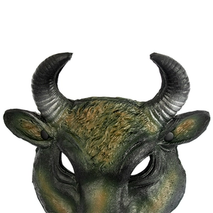 Macro shot of teal and brown buffalo mask showing detailed horn texture and foam finish