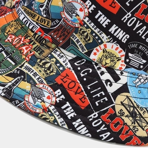 Close-up of street style graffiti bucket hat featuring retro collage prints and quilted brim