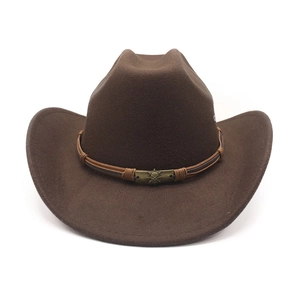 Detailed view of brown denim jazz hat featuring ethnic braided band and bronze metal buckle
