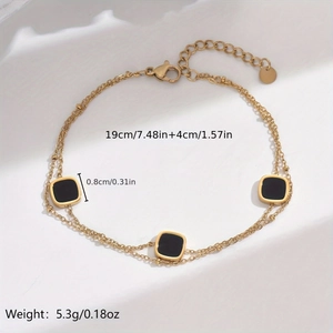 Double-layered gold chain bracelet with black square mother of pearl and size markings