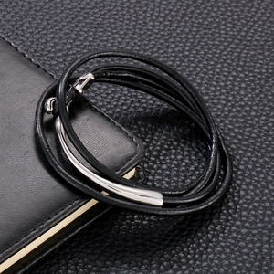 Detail of double-wrap black leather bracelet with silver fishhook metal buckle