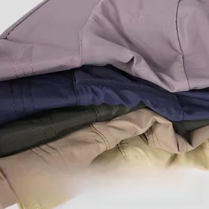 Detail of five different colored nylon sun hats with windproof brims and durable stitching