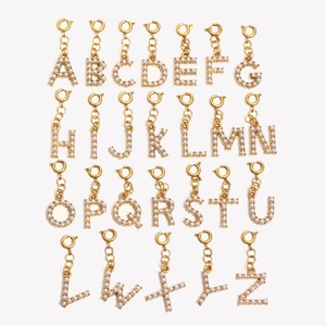 Detailed set of 26 alphabet charms in gold plating with elegant white pearls and spring clasps