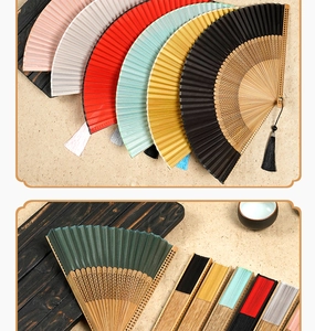 Close-up of assorted silk bamboo folding fans with matching decorative silk tassels