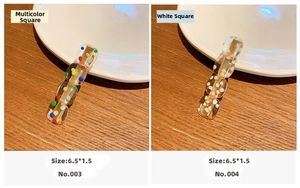Close-up of rectangle acrylic hair clips with colorful and white polka dot patterns