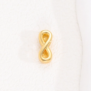 Detailed close-up of a polished gold infinity symbol charm for DIY mesh bracelets