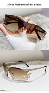 Detail of silver frame sunglasses with gradient brown flame-shaped lenses and rimless edges
