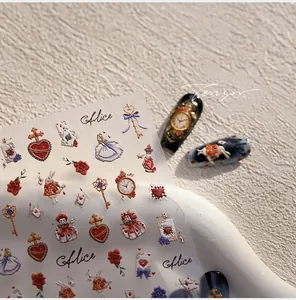 Detail view of Alice in Wonderland nail stickers with clock and heart relief patterns