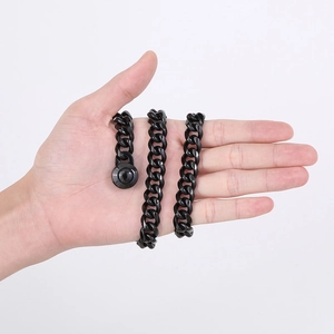 Men's 13mm black Cuban link chain necklace with CNC diamond buckle shown on palm