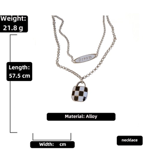 Detail of double-layer checkerboard necklace featuring a Dream charm and 57.5cm length info