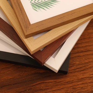 Modern minimalist solid wood photo frames in various colors and natural wood grain finishes