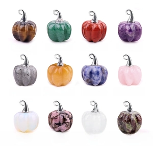 Variety of 20mm gemstone pumpkin pendants featuring tiger eye, amethyst, and quartz crystals