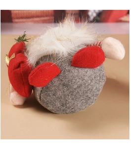 Detailed view of handmade Christmas gnome plush with red felt stitching and white faux fur