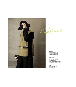 Detail of dark khaki waterproof apron vest with adjustable side straps and pocket label