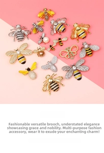 Macro view of crystal bee brooches with enamel detailing and faux pearl accents