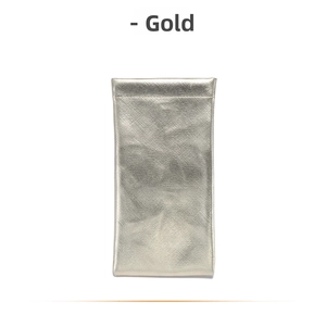 Detail of golden PU leather eyewear pouch with textured finish and squeeze closure
