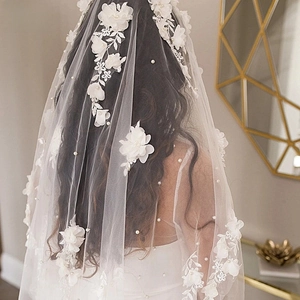 Detailed back view of bridal veil with 3D floral appliqués, embroidery and pearls