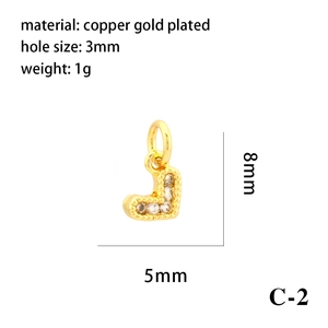 Macro shot of 18K gold plated heart pendant with technical specifications and dimensions