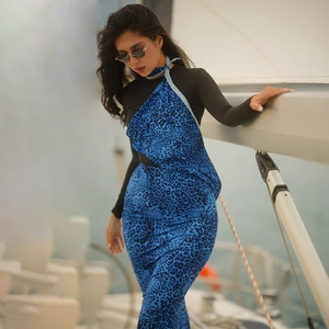 Detail showing blue leopard print fabric texture and layered design on yacht background