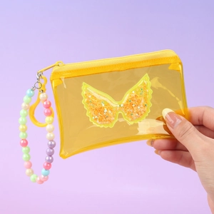 Detail of yellow transparent PVC coin purse with gold sequin bow and beaded wristlet
