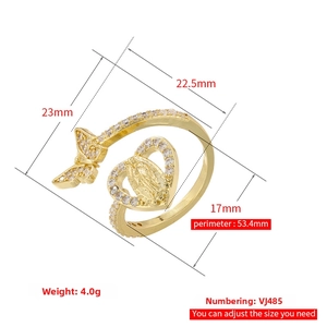 Detailed view of adjustable 18K gold-plated copper ring with zircon butterfly and heart icon