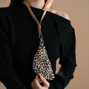 Detail of leopard print mini pouch necklace with brown leather cord and metal clasp