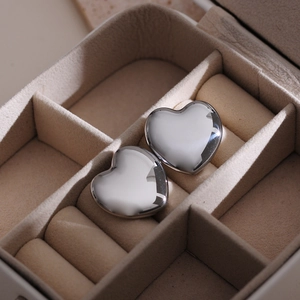 Polished heart-shaped titanium steel earrings in a premium beige velvet jewelry box