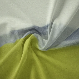 Detail of lightweight bohemian tapestry fabric with fine grain and three-color patchwork