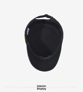 Detailed interior view of a black flat top military cap with stitching and wash label