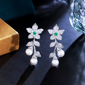 Luxurious silver leaf and pearl drop earrings with green gemstones and white zircons