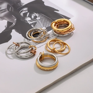 Minimalist linked 18K gold and silver rings set with zircon and multi-tone stacked design