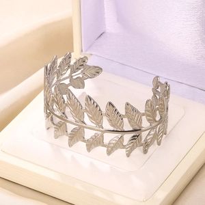 Detailed close-up of a silver olive leaf open cuff bracelet in a premium jewelry gift box