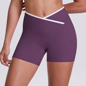 Detail view of the purple high waist yoga shorts featuring a V-shaped crossover waistband