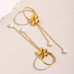Detail of 18K gold plated floral hoop earrings with elegant long pearl tassel chains