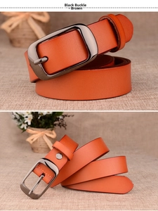 Detail view of a brown leather belt with a black metal pin buckle and edge stitching