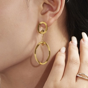 Elegant 18k gold plated double hoop earrings worn by a model for a modern look