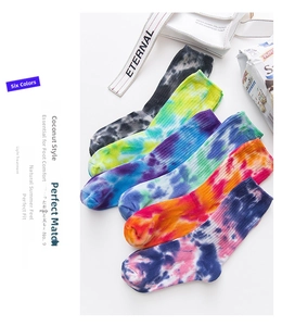 Detailed set of six colorful tie-dye crew socks with ribbed cuffs on white background