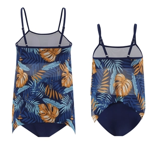 Detail of blue tropical leaf print tankini set with mesh hem and adjustable straps