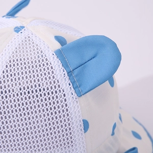 Detail of baby sun hat featuring breathable blue mesh fabric and cute decorative ears