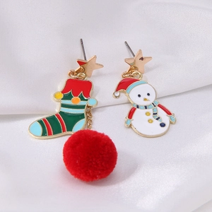 Asymmetric Christmas earrings featuring a green stocking with a red pompom and a cute snowman