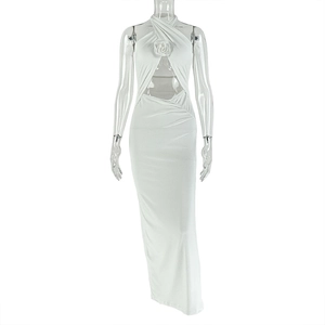 Detail of white halter dress featuring a 3D rose ornament and waist cutout design