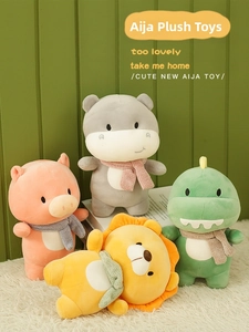 Close-up of cute plush animal dolls with knitted scarves in soft Morandi colors